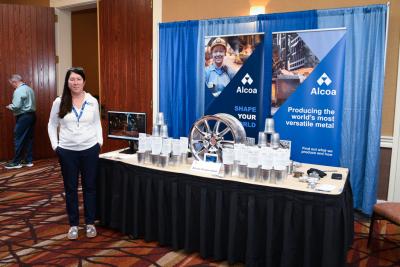 Woman standing at exhibitor booth