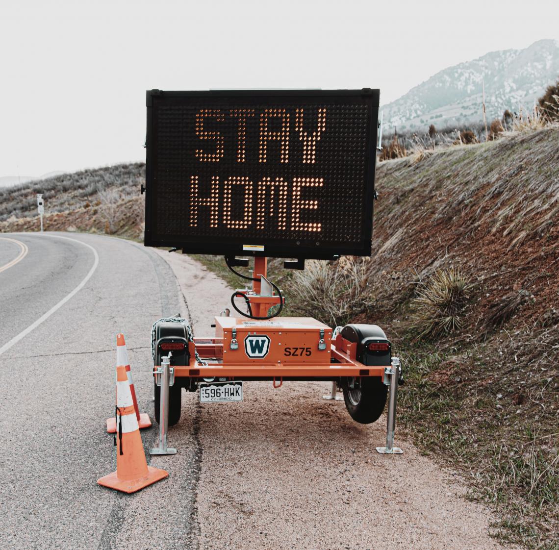 stay home road sign